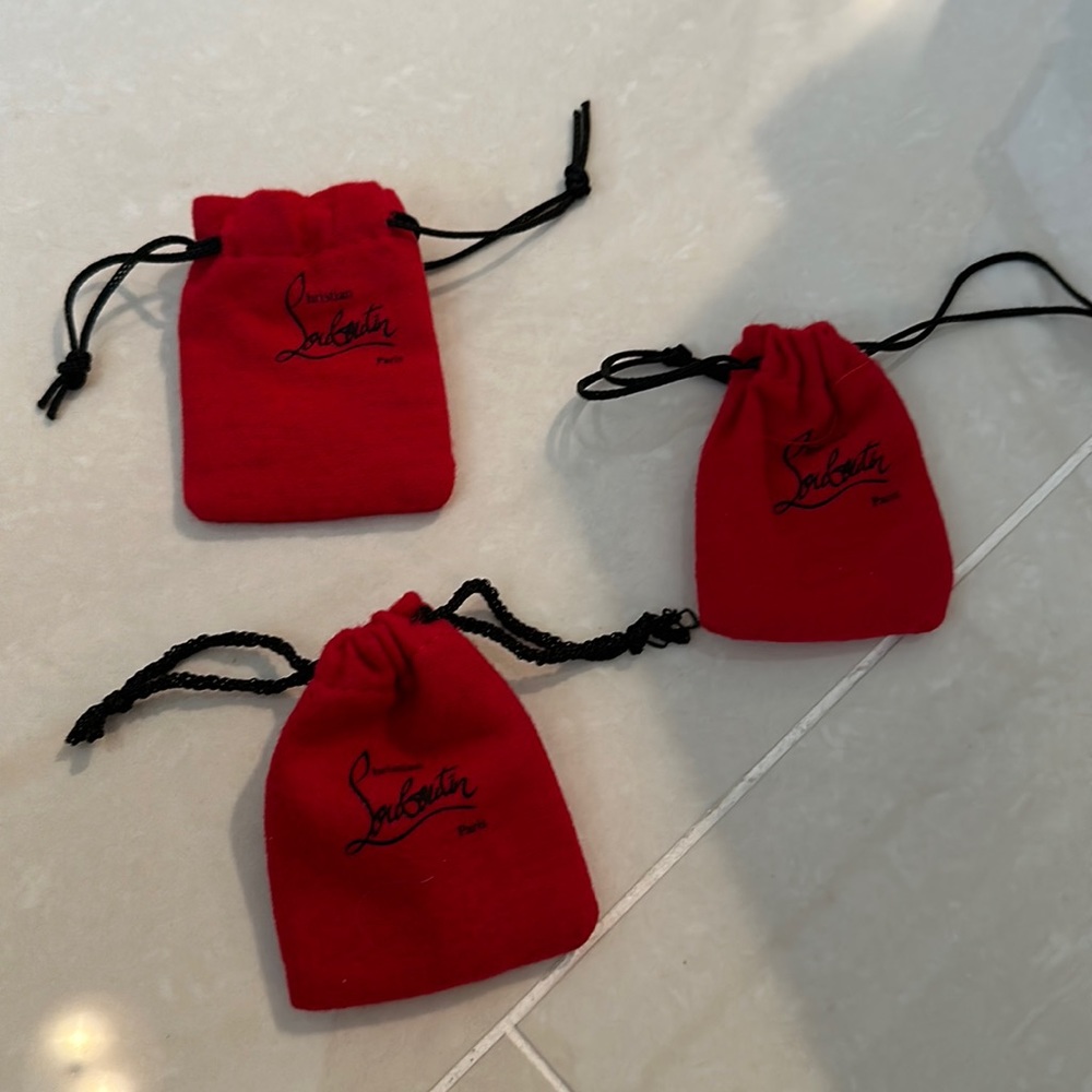 One mini Louboutin accessory pouch